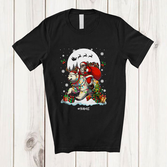 MacnyStore - Personalized Custom Name Santa Riding Polar Bear As Reindeer; Joyful Christmas Moon Snowing Animal T-Shirt