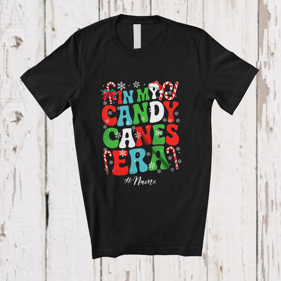 MacnyStore - Personalized Custom Name In My Candy Canes Era; Amusing X-mas Snowing Pajama Family T-Shirt
