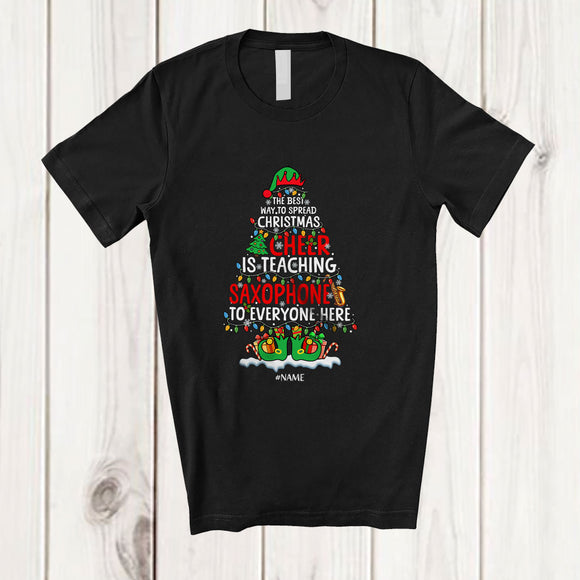 MacnyStore - Personalized Custom Name Spread Christmas Cheer Is Teaching Saxophone; Joyful Teacher Musician T-Shirt