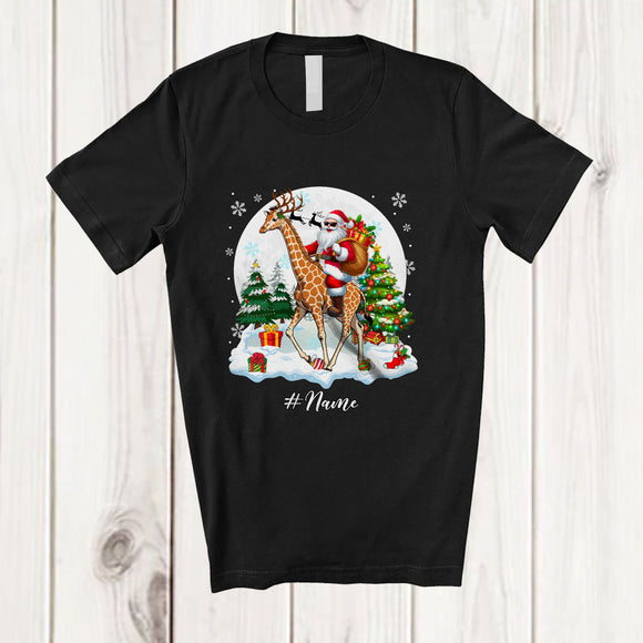 MacnyStore - Personalized Custom Name Santa Riding Giraffe Reindeer; Amusing Christmas Snow Animal T-Shirt