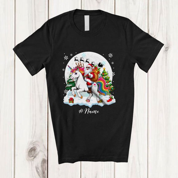 MacnyStore - Personalized Custom Name Santa Riding Unicorn Reindeer; Amusing Christmas Snow Family T-Shirt