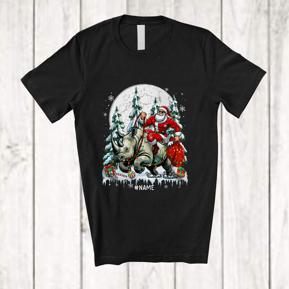 MacnyStore - Personalized Custom Name Santa Riding Rhinoceros; Merry Christmas Moon X-mas Tree Rhino Animal T-Shirt
