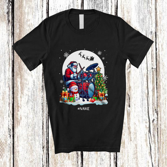 MacnyStore - Personalized Custom Name Santa Playing Drum; Joyful Christmas Moon Tree Snowman; Family T-Shirt
