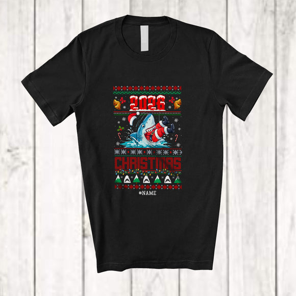 MacnyStore - Personalized Custom Name 2026 Christmas; Awesome X-mas Sweater Shark Eating Santa; Sea Animal T-Shirt