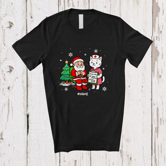 MacnyStore - Personalized Custom Name Nurse Cat With Santa; Humorous Christmas Tree Cat Nursing T-Shirt