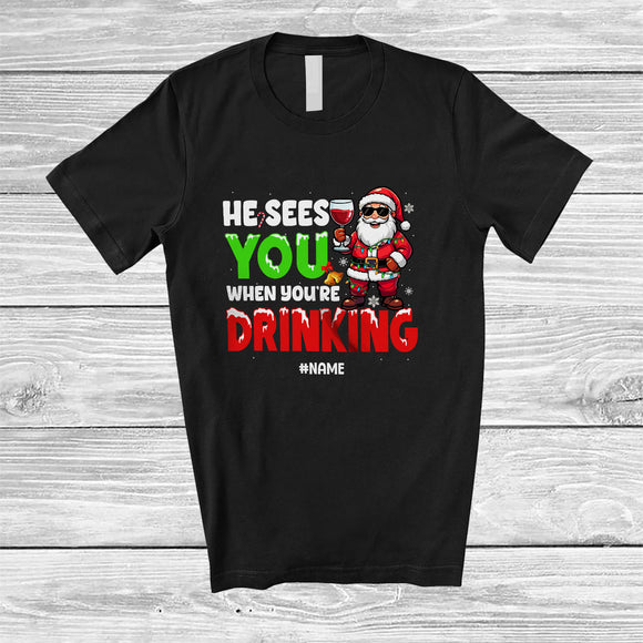 MacnyStore - Personalized He Sees You When Drinking; Fantastic Christmas Custom Name Santa Wine Drunker T-Shirt