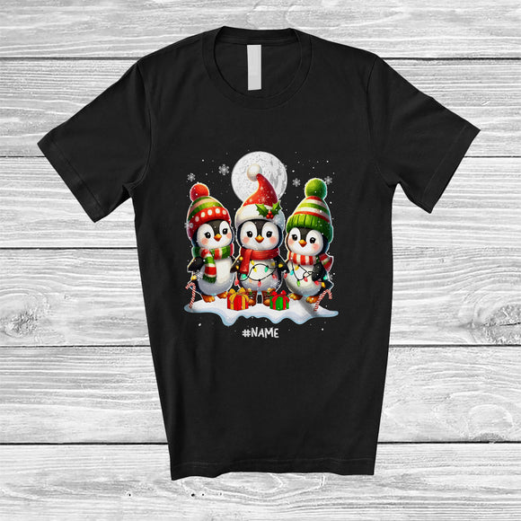 MacnyStore - Personalized Custom Name Three Santa Penguin; Adorable Christmas Lights Snowing Family T-Shirt