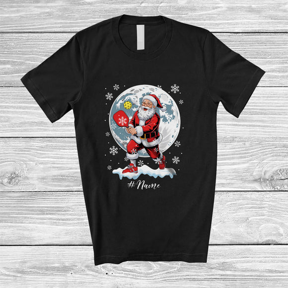 MacnyStore - Personalized Santa Playing Pickleballs; Amusing Christmas Moon Custom Name Sport Player T-Shirt