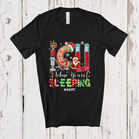 MacnyStore - Personalized Custom Name I.C.U When You're Sleeping; Humorous Christmas Snowing Santa Nurse T-Shirt
