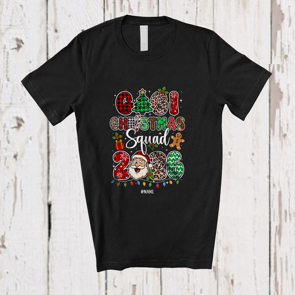 MacnyStore - Personalized Custom Name Gigi Christmas Squad 2026; Joyful Leopard Plaid Santa Face Family T-Shirt