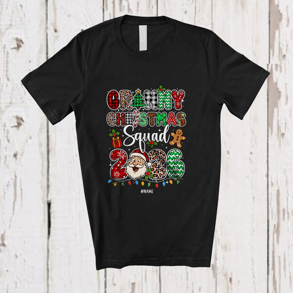 MacnyStore - Personalized Custom Name Granny Christmas Squad 2026; Joyful Leopard Plaid Santa Face Family T-Shirt