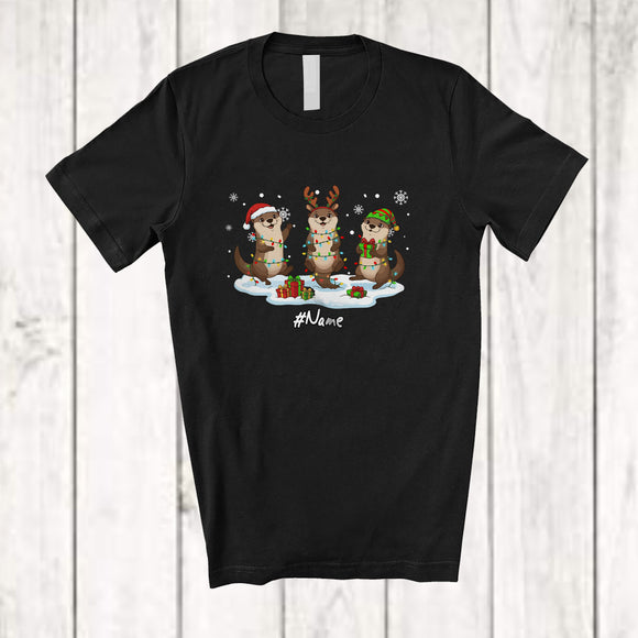 MacnyStore - Personalized Custom Name Three Santa Elf Otter Snowing; Lovely Christmas Lights Sea Animal T-Shirt