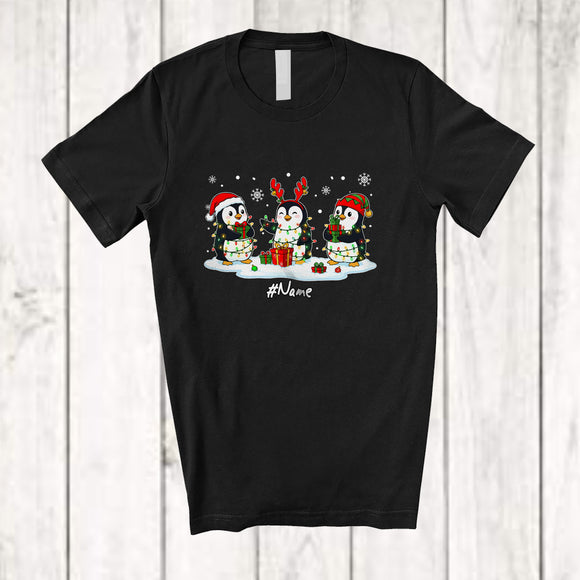 MacnyStore - Personalized Custom Name Three Santa Elf Penguin Snowing; Lovely Christmas Lights Sea Animal T-Shirt