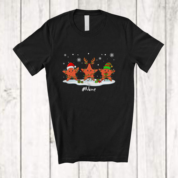 MacnyStore - Personalized Custom Name Three Santa Elf Starfish Snowing; Lovely Christmas Lights Sea Animal T-Shirt
