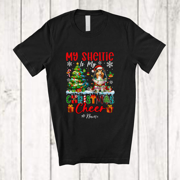 MacnyStore - Personalized Custom Name Shelties Is My Christmas Cheer; Lovely Plaid Tree Lights Santa T-Shirt