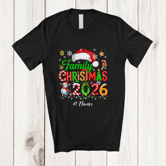 MacnyStore - Personalized Custom Name Family Christmas 2026; Merry X-mas Lights Snowing Santa Lover T-Shirt