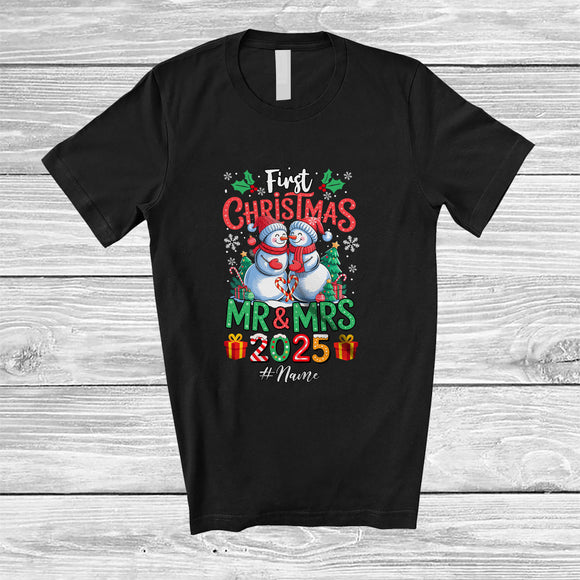 MacnyStore - Personalized Custom Name First Christmas Mr & Mrs 2025; Lovely X-mas Couple Snowman T-Shirt