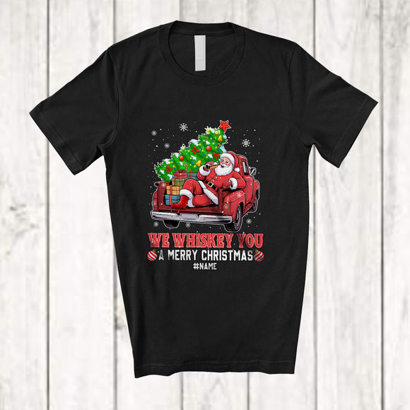 MacnyStore - Personalized Custom Name Whiskey You A Merry Christmas; Joyful Santa On Pickup Truck; Drinking T-Shirt