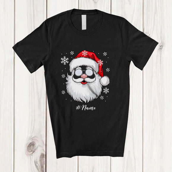 MacnyStore - Personalized Custom Name Christmas Santa Face; Joyful X-mas Lights Santa; Snowing Family T-Shirt