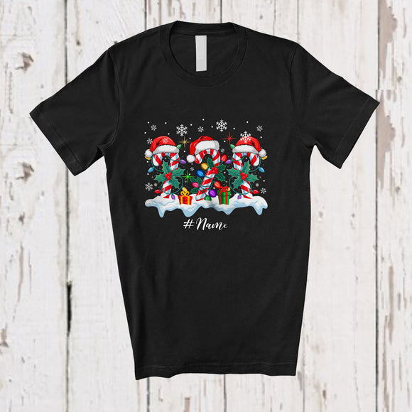 MacnyStore - Personalized Custom Name Three Santa Candy Canes; Amusing Christmas Lights Snowing; Family T-Shirt