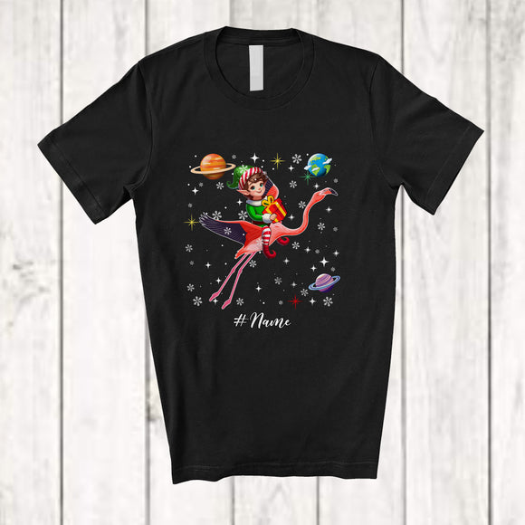 MacnyStore - Personalized Custom Name Elf Riding Flamingo; Awesome Christmas Elf In Space Galaxy T-Shirt