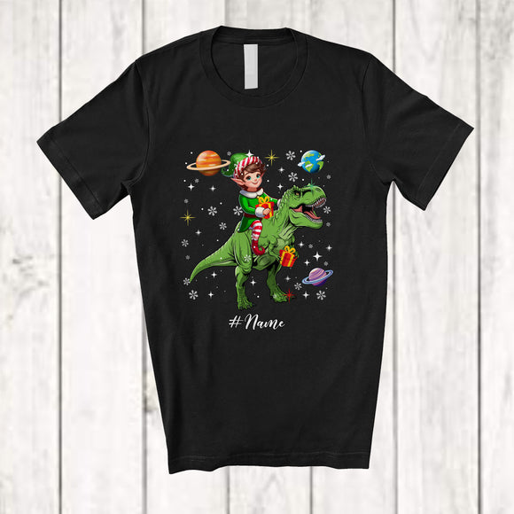 MacnyStore - Personalized Custom Name Elf Riding T-Rex; Awesome Christmas Elf In Space Galaxy T-Shirt