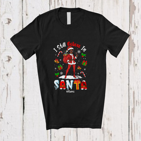 MacnyStore - Personalized Custom Name Still Believe In Santa; Joyful Christmas Afro Women; Black African T-Shirt