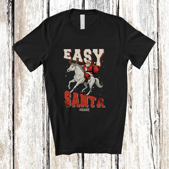 MacnyStore - Personalized Custom Name Easy Santa; Amusing Christmas Santa Riding Horse Reindeer T-Shirt