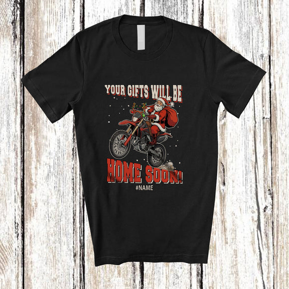 MacnyStore - Personalized Custom Name Your Gifts Will Be Home Soon; Joyful Christmas Santa Riding Dirt Bike T-Shirt