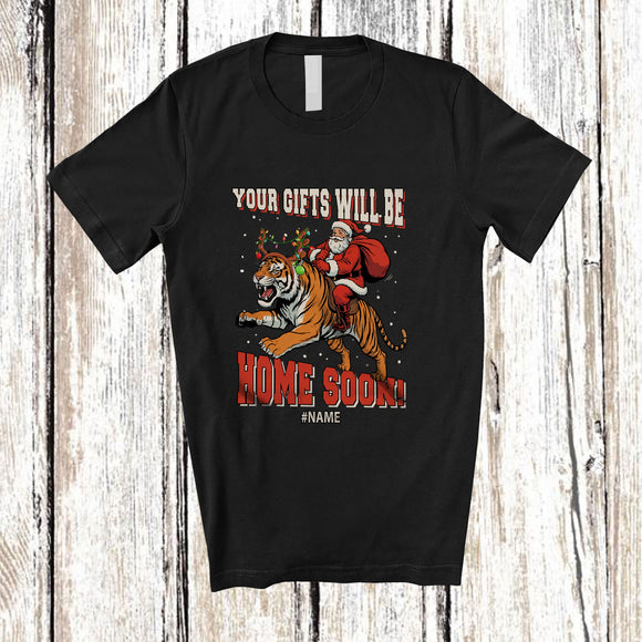 MacnyStore - Personalized Custom Name Your Gifts Will Be Home Soon; Joyful Christmas Santa Riding Tiger T-Shirt