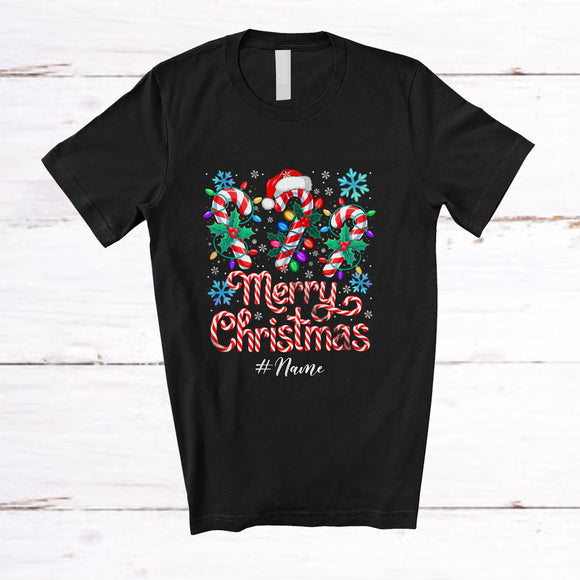 MacnyStore - Personalized Custom Name Merry Christmas; Amazing X-mas Lights Three Santa Candy Canes T-Shirt