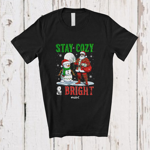 MacnyStore - Personalized Custom Name Stay Cozy And Bright; Amazing Christmas Moon Santa Snowman T-Shirt