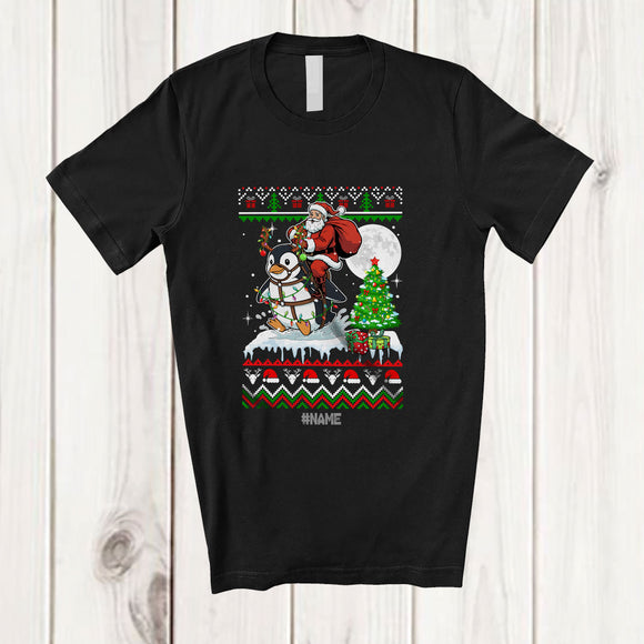 MacnyStore - Personalized Custom Name Santa Riding Penguin; Amusing Christmas Sweater Tree Sea Animal T-Shirt