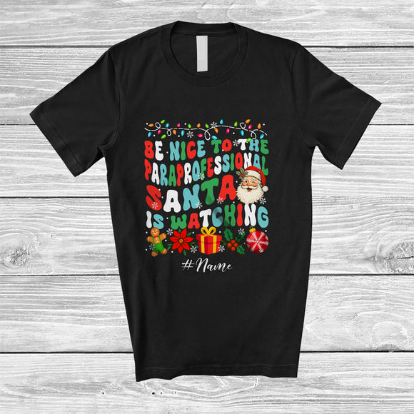MacnyStore - Personalized Custom Name Nice To Paraprofessional Santa Watching; Lovely Christmas Groovy Jobs T-Shirt