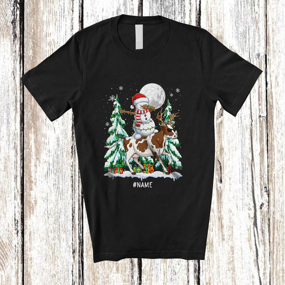 MacnyStore - Personalized Custom Name Dabbing Snowman Riding Cow Reindeer; Lovely Christmas Farmer T-Shirt