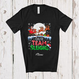 MacnyStore - Personalized Custom Name Our Team Sleighs; Amusing Christmas Moon Santa Sleigh Reindeer T-Shirt