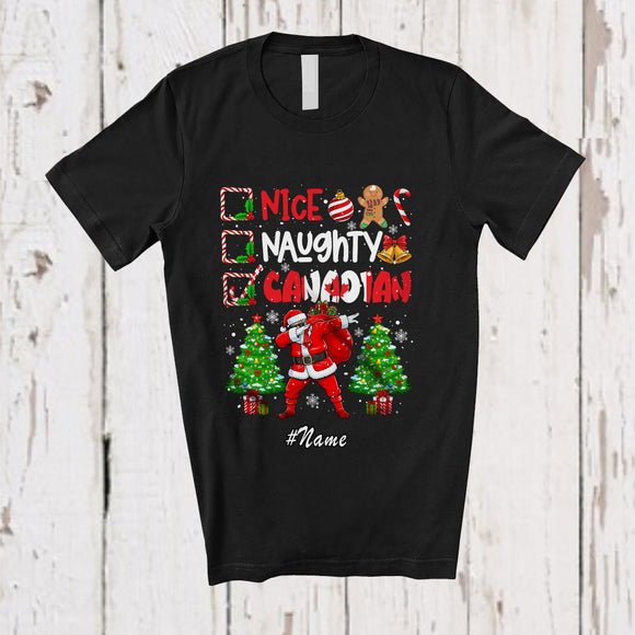 MacnyStore - Personalized Custom Name Nice Naughty Canadian; Joyful Christmas Trees Dabbing Santa Country T-Shirt