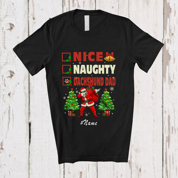 MacnyStore - Personalized Custom Name Nice Naughty Dachshund Dad; Lovely Christmas Trees Dabbing Santa T-Shirt