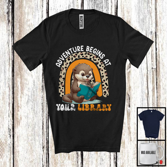 MacnyStore - Adventure Begins At Your Library, Adorable Otter Reading Book, Summer Leopard Rainbow T-Shirt