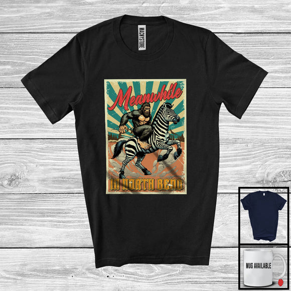 MacnyStore - Meanwhile In North Bend, Humorous Vintage Bigfoot Riding Zebra, Animal Lover T-Shirt