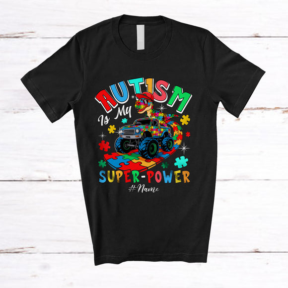 MacnyStore - Personalized Autism Is My Super-power; Humorous Custom Name Puzzle Dino T-Rex On Monster Truck T-Shirt