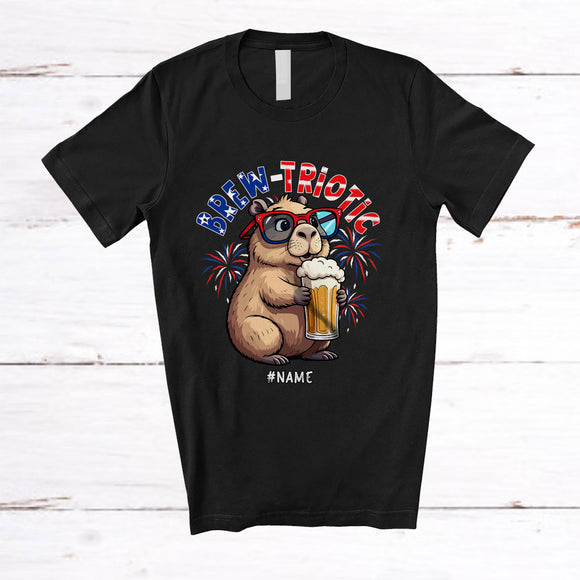 MacnyStore - Personalized Brew-triotic; Cheerful 4th Of July Capybara Drinking Beer; Custom Name Patriotic T-Shirt