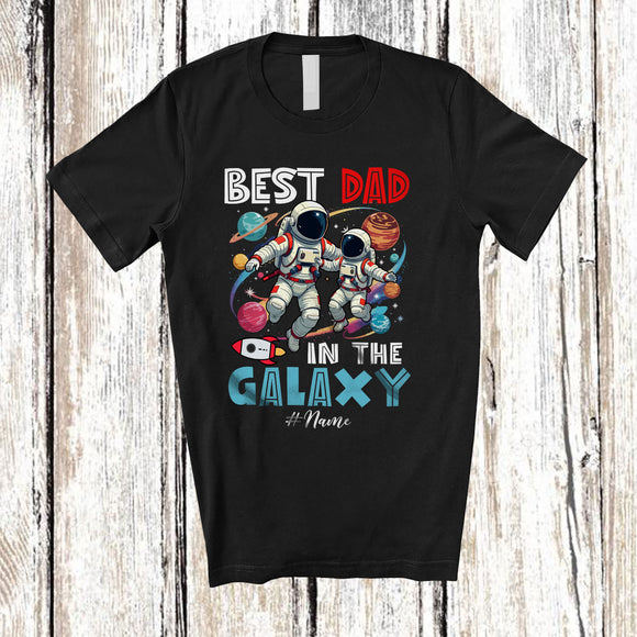MacnyStore - Personalized Custom Name Best Dad in the Galaxy; Amazing Father's Day Astronaut Space T-Shirt