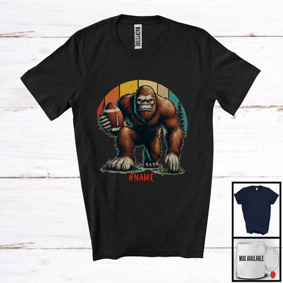 MacnyStore - Personalized Custom Name Bigfoot Playing Football; Humorous Vintage Retro Sport Player T-Shirt