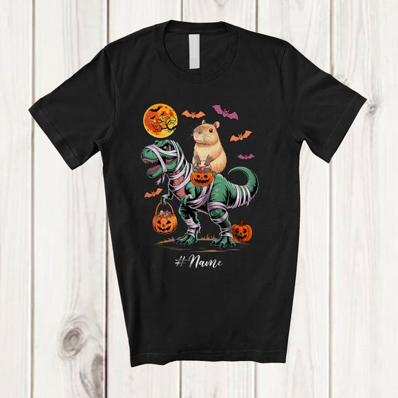 MacnyStore - Personalized Custom Name Capybara Riding T-Rex Mummy; Scary Halloween Dinosaur Cosplay; Family T-Shirt