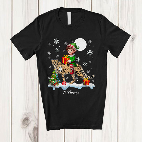 MacnyStore - Personalized Custom Name Elf Riding A Cheetah; Amazing Christmas Snowing Cheetah Wild Animal T-Shirt