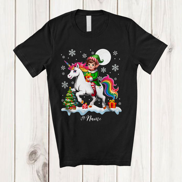 MacnyStore - Personalized Custom Name Elf Riding A Unicorn; Amazing Christmas Snowing Unicorn Lover T-Shirt