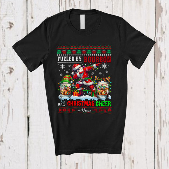 MacnyStore - Personalized Custom Name Fueled By Bourbon Christmas Cheer; Joyful Sweater Drinking Santa Dabbing T-Shirt