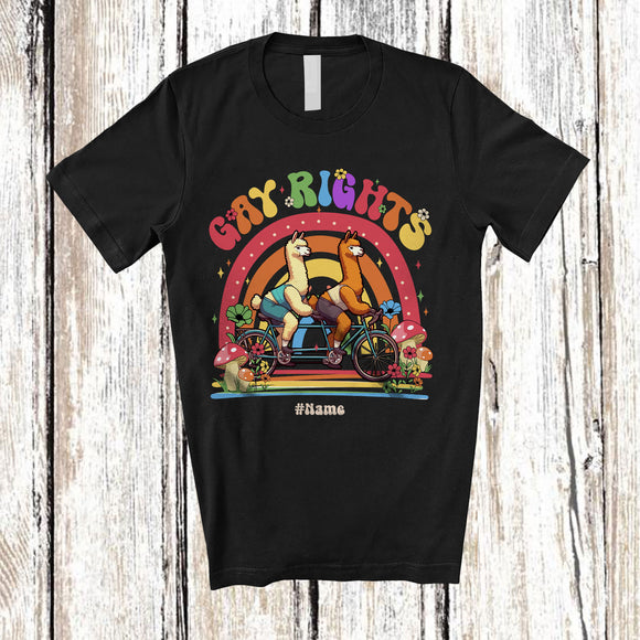 MacnyStore - Personalized Custom Name Gay Rights; Adorable LGBTQ Couple Llamas Riding Bicycle Rainbow T-Shirt