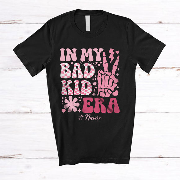 MacnyStore - Personalized Custom Name In My Bad Kid Era; Cheerful Mother's Day Pink Flower Skeleton Hand T-Shirt